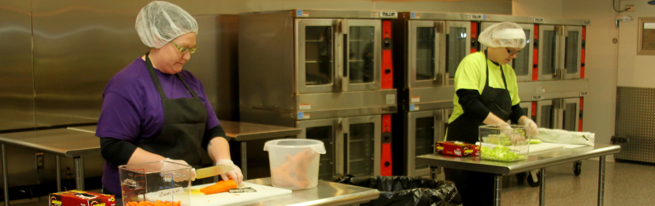 Food preparation in an industrial kitchen.