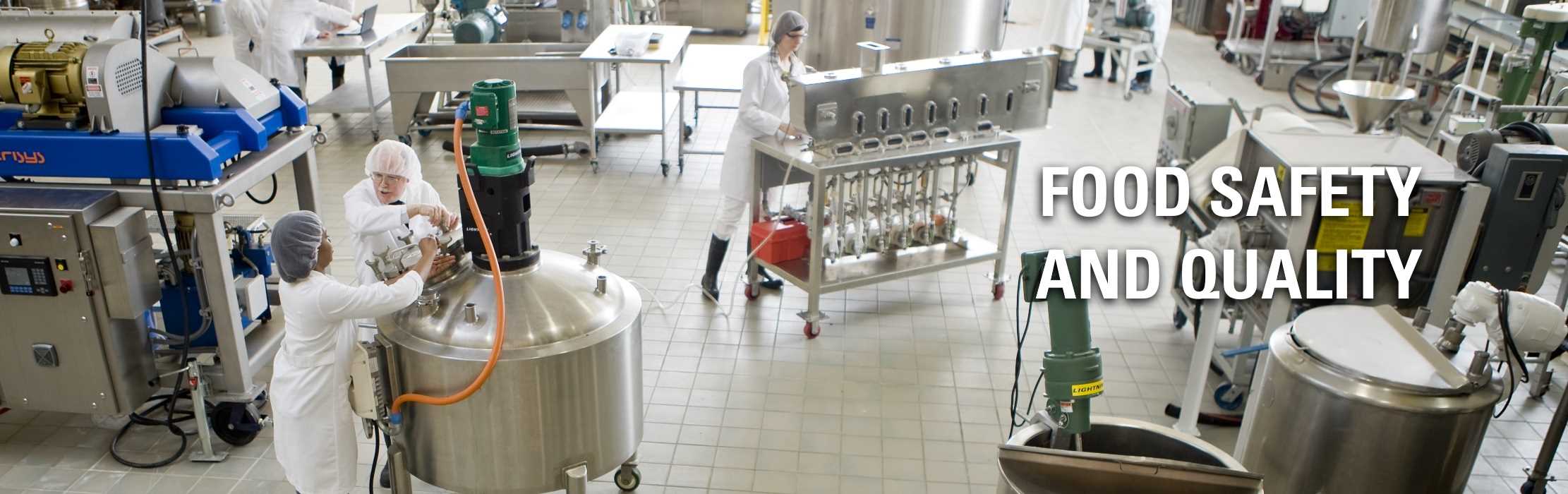 Technicians working in a food processing incubator: Food Safety and Quality.