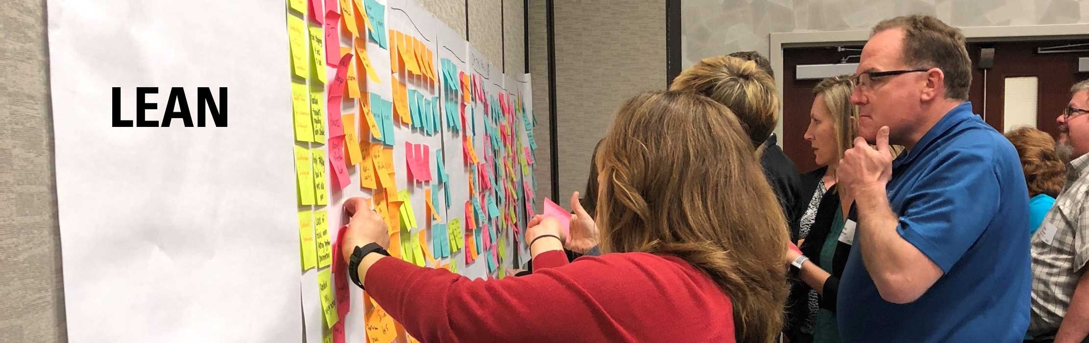 Continuous improvement experts review a value stream map at an Iowa Lean Consortium training event: Lean.